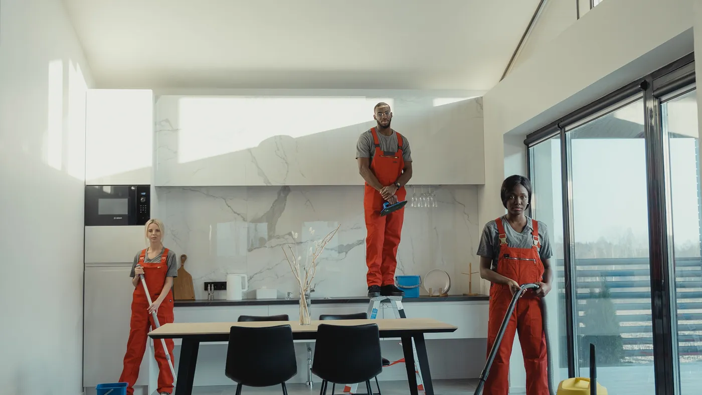 Bespoke Cleaning DFW team members cleaning a modern office workspace